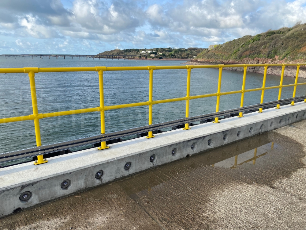 Interclamp safety yellow tube clamp guardrail constructed on a port jetty
